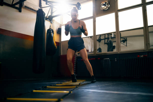 istock Female kickboxer exercising in the gym 2171113738