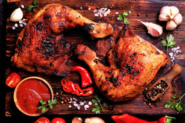 istock Roasted chicken legs with spices and vegetables 2171119825