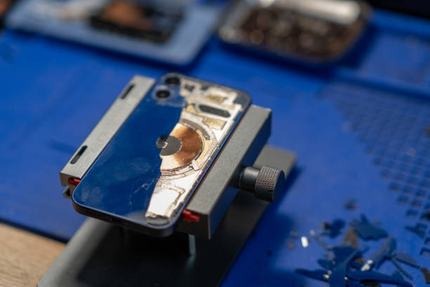 istock Smartphone Repair, A professional technician replacing the back glass 2171120757