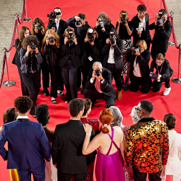 istock Celebrities posing on steps at red carpet event 2171121121
