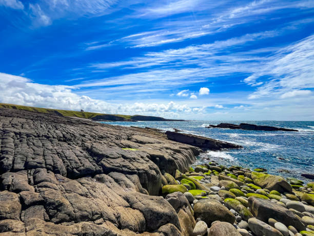 istock Rocky Shoreline at Mullaghmore with Blue Skies and Ocean Waves 2171125588