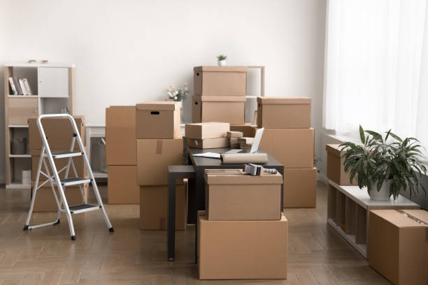 istock Stockroom filled with cardboard boxes stacked and arranged around room 2171127502