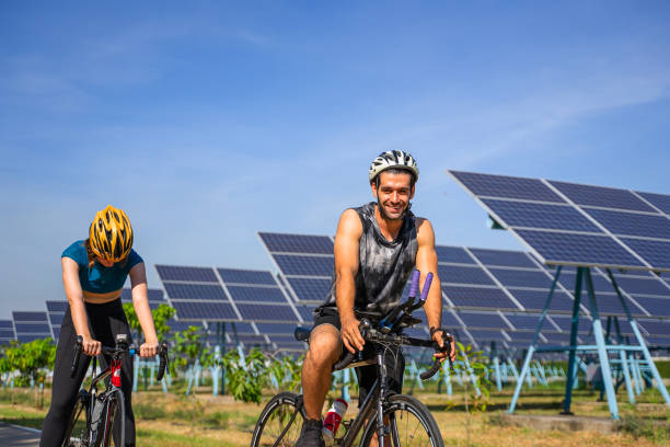 istock People are exercising near solar powerplant. 2171131846