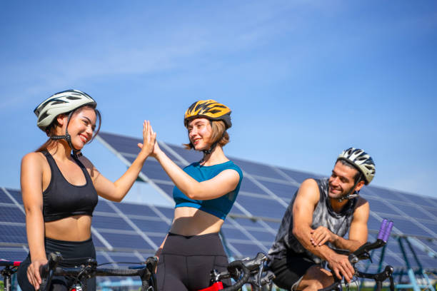 istock People are exercising near solar powerplant. 2171131849