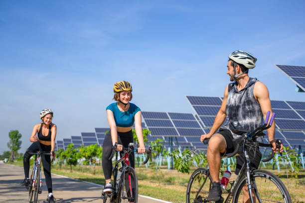 istock People are exercising near solar powerplant. 2171131873