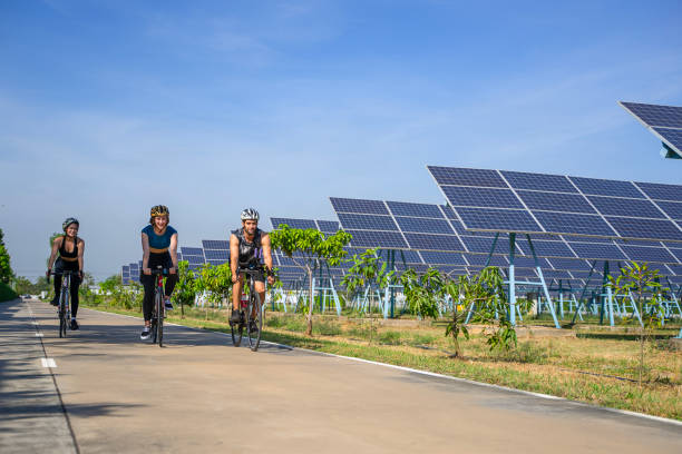 istock People are exercising near solar powerplant. 2171131881