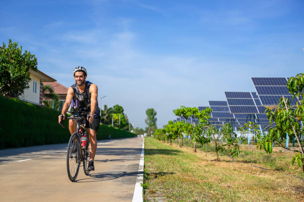 istock People are exercising near solar powerplant. 2171131885