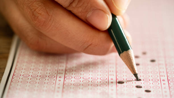istock Student filling out answers to a test 2171139849