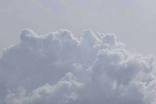 The sky is cloudy and grey. The clouds are white and fluffy