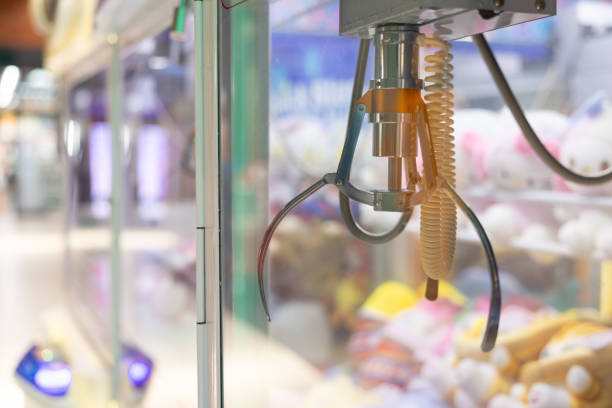 istock A claw machine with toy dolls. 2171142444