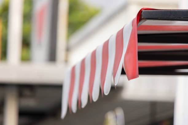 A red and white striped awning is on a building