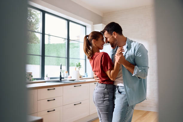 istock Romantic couple dancing in the kitchen at home. 2171142762