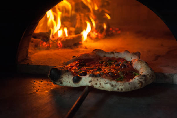 istock Italian pizza on a blade in a Neapolitan wood-fired oven 2171144301