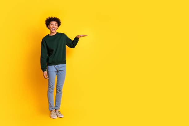 istock Full size photo of nice young man measure empty space wear pullover isolated on yellow color background 2171146857