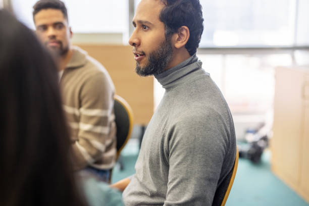 istock Middle eastern man sharing his mental health story with the support group 2171148858