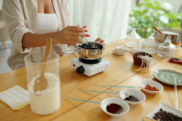 istock Woman Melting Wax With Aroma Materials 2171151000