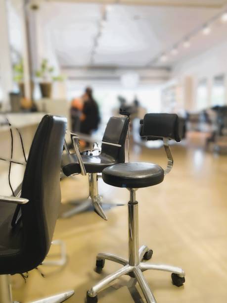 An extraction system in a hair salon is crucial during coloring or bleaching to ensure a healthy environment by reducing harmful fumes from chemicals like ammonia and peroxide.