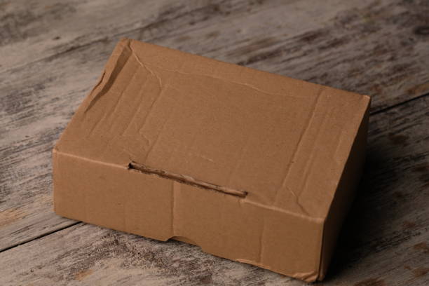 istock cardboard packaging on a wooden table. recycle paper. 2171157817