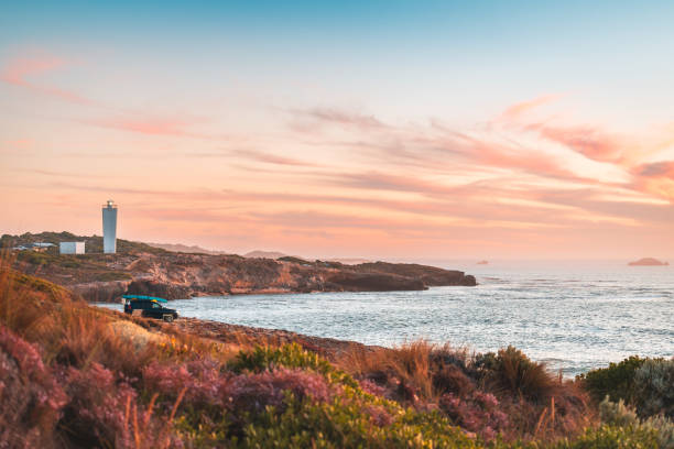 4WD car parked on rocky beach in Robe, SA
