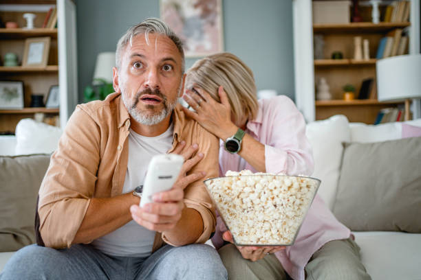 istock Mature couple scared by horror movie 2171162202