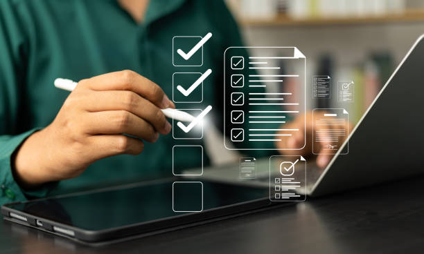 istock Digital Checklists for efficient business management, Businessman touching marking on checklist guide to paperless assessment and Future Success, Streamlining operations with online surveys. 2171163610