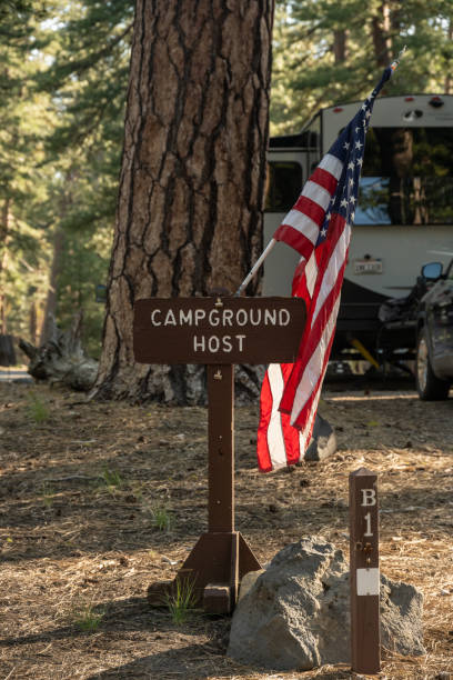 Campground Host Sign With American Flag Mounted On It