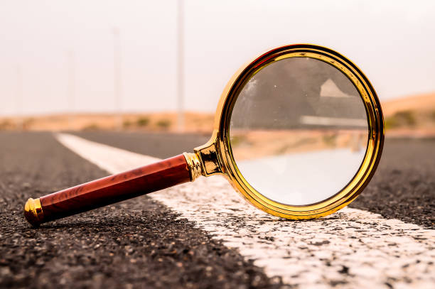 istock A magnifying glass is on the road 2171165120