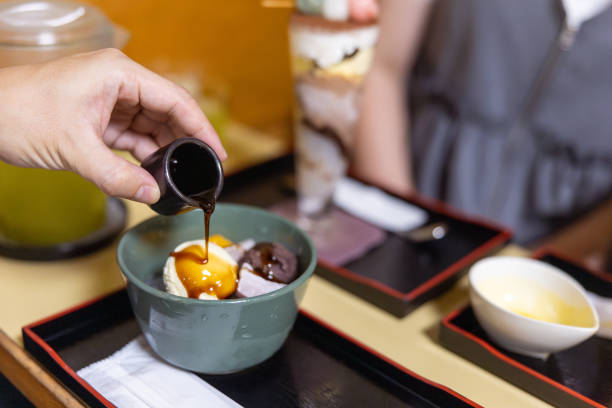 Father pouring syrup on Japanese sweets