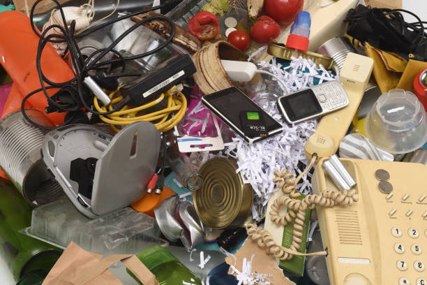 istock close up of  garbage with plastic containers, glass, cans, paper, organic,e-waste, on white background 2171166455