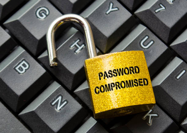 istock Top view of Password Compromised text engraved on padlock with keyboard background. Password and cybersecurity concept 2171166538