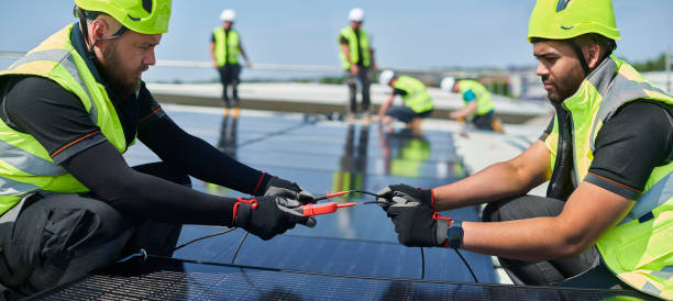 solar panels being fitted to factory roof