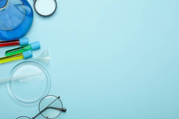 istock Laboratory glassware (Test tubes with flask) and accessories on blue background. Top view. Flat lay. Copy space 2171169765