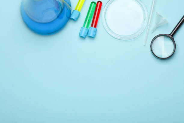 istock Laboratory glassware (Test tubes with flask) and accessories on blue background. Top view. Flat lay. Copy space 2171169770