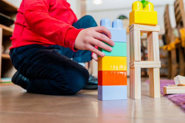 istock Low section of a child playing with blocks at home 2171172259