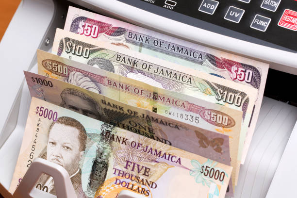 istock Jamaican dollar in the counting machine 2171173729