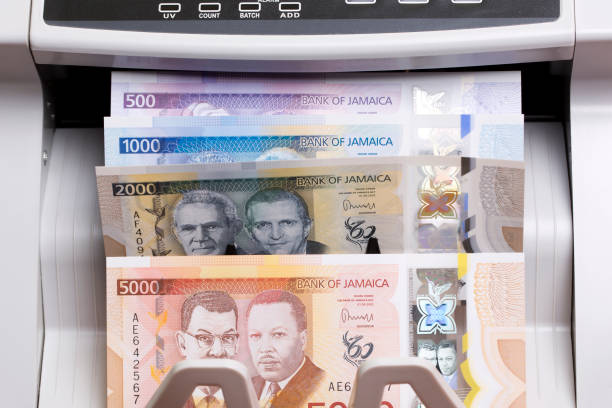 istock Jamaican dollar in the counting machine 2171173755