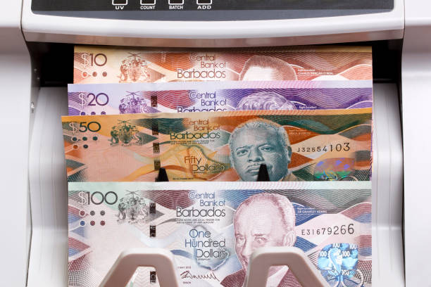 istock Barbadian dollar in the counting machine 2171173784