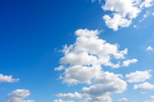 istock White and light gray grey puffy low-level cumulus clouds against the backdrop of a blue sky 2171175329