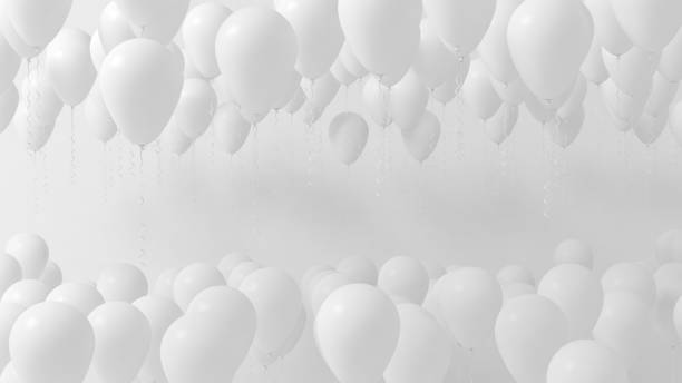 istock White balloons party celebration background 2171176410