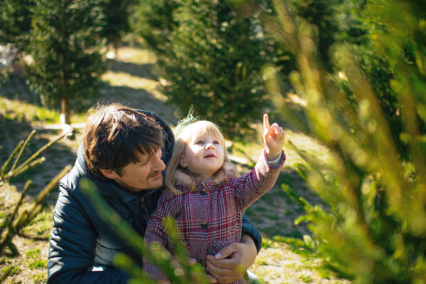 istock Family choosing Christmas tree 2171176597