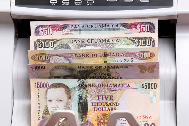 istock Jamaican dollar in the counting machine 2171179642