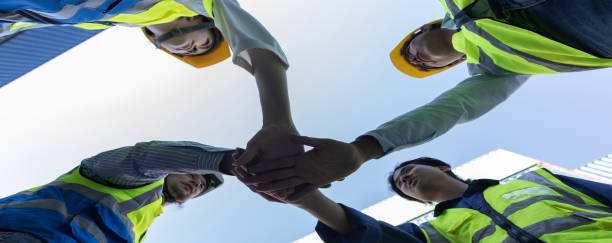 istock Group of successful Worker people showing unity with their hands together. Photo Foreman hands on top  as symbol of Teamwork. Teamwork concept. 2171179971