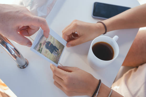 istock Looking at old photos with morning coffee 2171183940