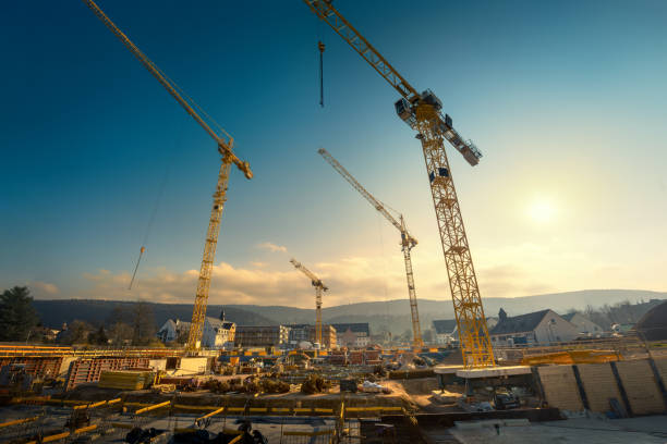istock Large construction site with four cranes looming into the sky 2171187311
