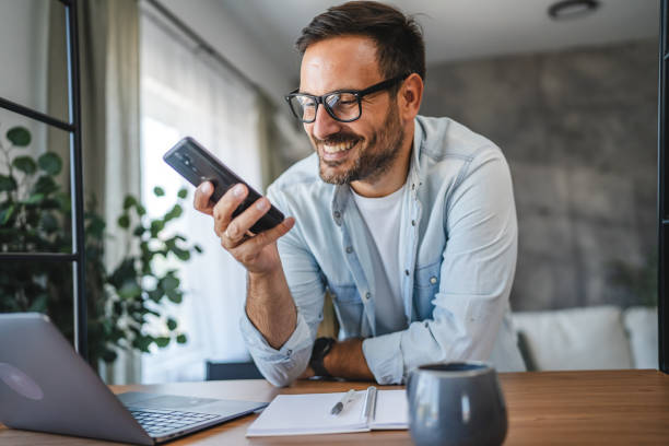 istock Man smile and enjoy while use smart phone at home 2171188817