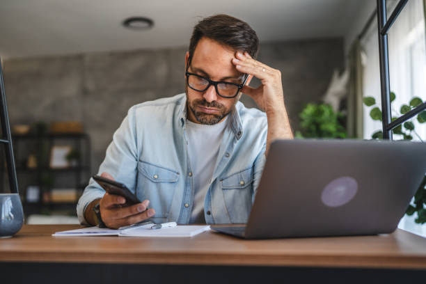 istock Man stressed while look at mobile phone, read a bad news 2171190437