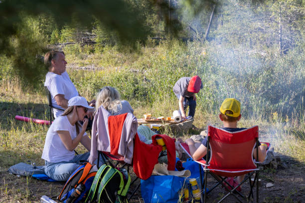 istock Multi-generation family picnics in wilderness 2171192132