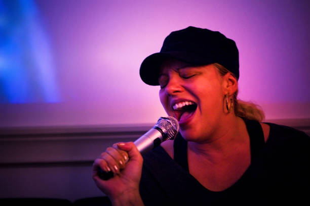 istock Woman Singing Karaoke in Japan 2171193780