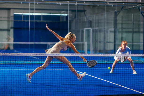istock Athletic female padel player attempting a difficult backhand 2171195768