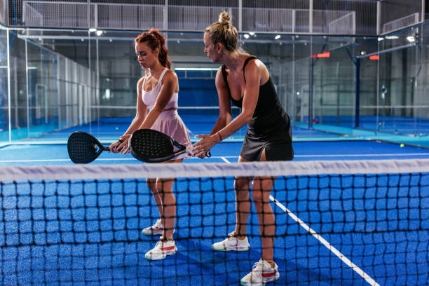 istock Padel coach and a student on a padel court 2171195788